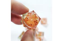 China Orange Flowing Sand​ Resin Gaming Dice Multi Noodle Tablet Game Dice Set supplier