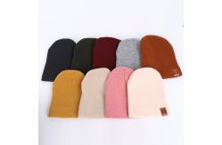 China Leather Patch Knit Beanie Hats Custom Design Warm Hat Cap Yellow Beanie Hats supplier