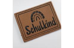 China Microfiber Embossed Logo PU Leather Label Sew On Clothing Customize Design supplier