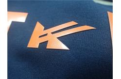 China Custom Shiny Orange TPU Iron On Clothing Patches , Heat Transfer Shoe Label supplier