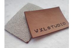 China Personalized Logo Garment Leather Patch Embossed Black Logo Leather Label supplier