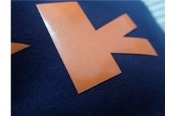 China Custom Shiny Orange TPU Iron On Clothing Patches , Heat Transfer Shoe Label supplier