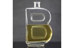 China Base Material Glass Bottle with Unique Letter Shape and Cork Cap supplier