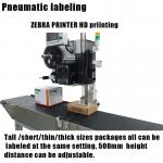 Beverage Labeling Systems with Real Time Printing and Top Side Application Features