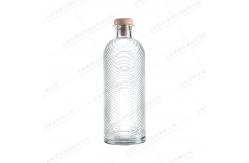 China Exquisite Carved Exterior Glass Bottle with Customizable Logo and Transparent Design supplier