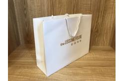 China 250gsm Recycled ODM White Paper Shopping Bags With Handles supplier