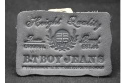 China Small Black Custom Leather Clothing Labels Debossed For Jeans supplier