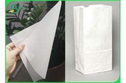 China Glossy 60gsm Hamburger Wrapping Paper Grease Proof White Kraft Paper Rolls supplier