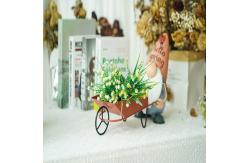 China Recycled Small Metal Garden Ornaments Gnome Pushing The Cart With Planter supplier