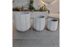 China Waterproof and Fireproof Fiber Clay Flower Planters with Modern Hand Carving Design supplier