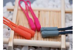 China 3D Embossed Plastic Zipper Puller With Polyester String For Garments supplier