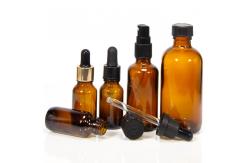 China Customized Hot Stamping 2oz Glass Dropper Bottles With Plastic Lid supplier