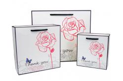China Custom Luxury White Paper Carry Bag With Artwork Printing Manufacturers supplier