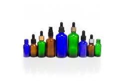 China Customized Hot Stamping 2oz Glass Dropper Bottles With Plastic Lid supplier