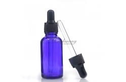 China Cylindrical 30ml Blue Oil Dropper Glass Bottle With Gold Dropper supplier