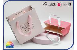 China Pink Printing Present Package Paper Shopping Bags With Ribbon Handles supplier