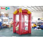 Red Custom Inflatable Products / PVC Tarpaulin Cube Inflatable Money Booth With 2 Air Blowers for sale
