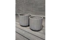 China Exquisite Hand Carved Fiber Clay Planter with Drainage Holes supplier