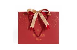 China Customized Printed Red Christmas Paper Bags with Ribbon Bow supplier