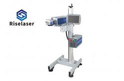 China Permanent 30w Co2 Flying Laser Marking Machine For Plastic Paper Packaging Line supplier
