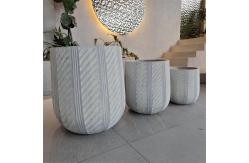 China Waterproof and Fireproof Fiber Clay Flower Planters with Modern Hand Carving Design supplier
