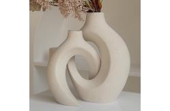 China Embrace Hollow Ceramic Vase for Modern Home Decor supplier