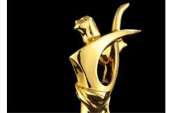 China Poly Resin Material Award Cups Trophies With Abstract Figure Design supplier