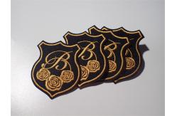 China Eco Unique Style Custom Embroidered Patch Gold Rose Raised Effect supplier