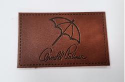 China Customized Design PU Leather Patches Garment Labels Embossed Logo supplier