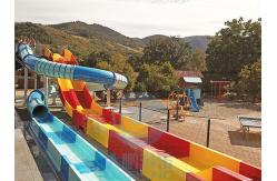 China Spiral Enclosed Water Slide Rainbow Racing Pool Slide With Led Light Effect supplier