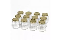 China 730ml Polygon Hexagon Glass Storage Bottles Embossed For Chili Sauce Pickle supplier