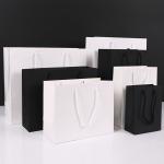 China Premium Kraft Paper Gift Bags Thickened Clothing Shopping Bags With Rope Handles factory