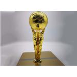 Shiny Gold Plated Custom Trophy Cup With The Statue Holding The Ball Design for sale