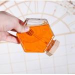 Custom SGS Glass Storage Bottles Hexagon Honey Jars 0.5L To 1L Wooden Lid for sale