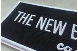 China Washable Black Polyester Custom Clothing Patches / Adhesive Embroidered Patches supplier