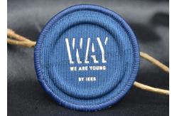 China OEKO 5mm Embossed Patches Canvas Woven Label Patch For Swimwear supplier