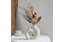 China Embrace Hollow Ceramic Vase for Modern Home Decor supplier
