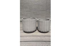 China Exquisite Hand Carved Fiber Clay Planter with Drainage Holes supplier