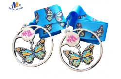 China Shiny Silver Stock Dancing Butterfly Relief Medals Cut Out With Sublimated Ribbon supplier