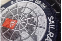 China Washable Black Polyester Custom Clothing Patches / Adhesive Embroidered Patches supplier