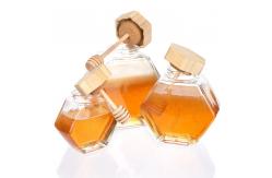 China 100ml 220ml Hexagonal Glass Food Jars With Lids Dipper For Honey supplier
