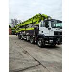 Zoomlion's 56-meter concrete pump truck is equipped with German Shandeka chassis, specially built for high-rise buildings and large projects. for sale