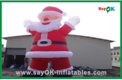 China Custom Red Inflatable Christmas Santa Claus With Bread Inflatable Cartoon Character supplier