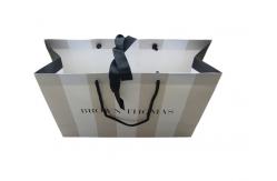 China Order Custom Printed Paper Merchandise Bag Business Packaging Online With Eyelet supplier