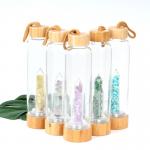 Round Glass Water Bottle With Natural Crystal Gemstone Center Elixir Crystal Point for sale