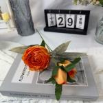 Decorative flowers with artificial rose ornaments