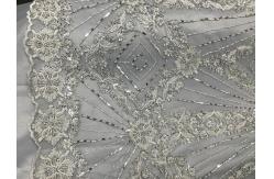 China Beautiful Silver Embroidered Heavy Beaded Lace Fabric , Beaded Net Fabric 130cm Width supplier