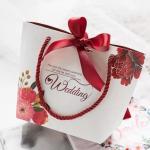 Custom Logo Printed Paper Carrier Bags Luxury Wedding Gift Bags With Ribbon Closure for sale