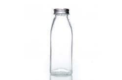 China Bpa Free 25Oz 32Oz Pasterurization Juice Milk Delivery Glass Bottle With Metal Lid supplier