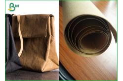 China Virgin And Natural Fabric Material Kraft Liner Paper For Handbags And Jeans supplier